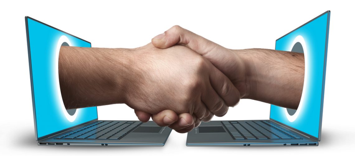 Image of a smart-contract, two computers handshaking